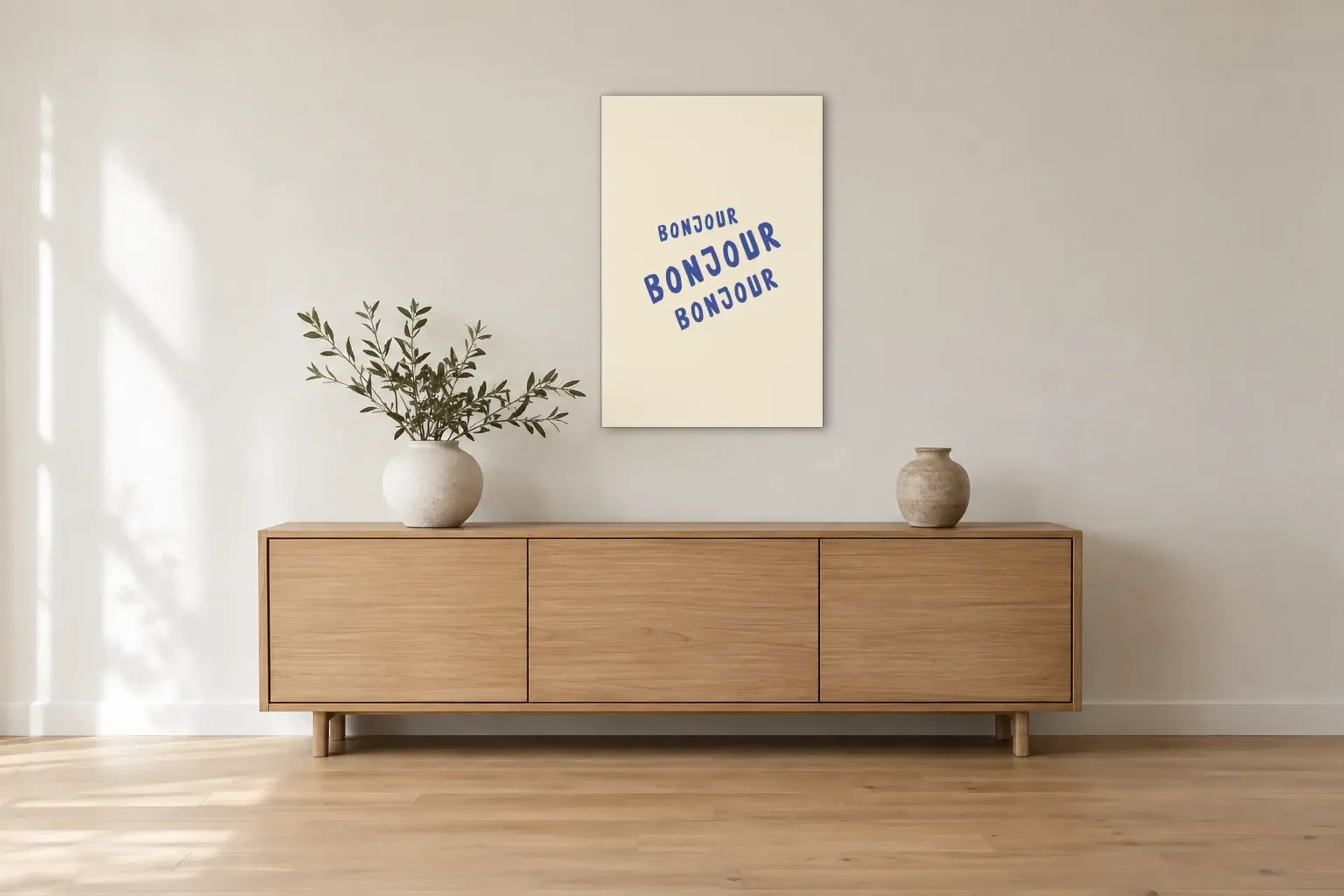 Bonjour als Wandbild über einem 180-cm-Sideboard