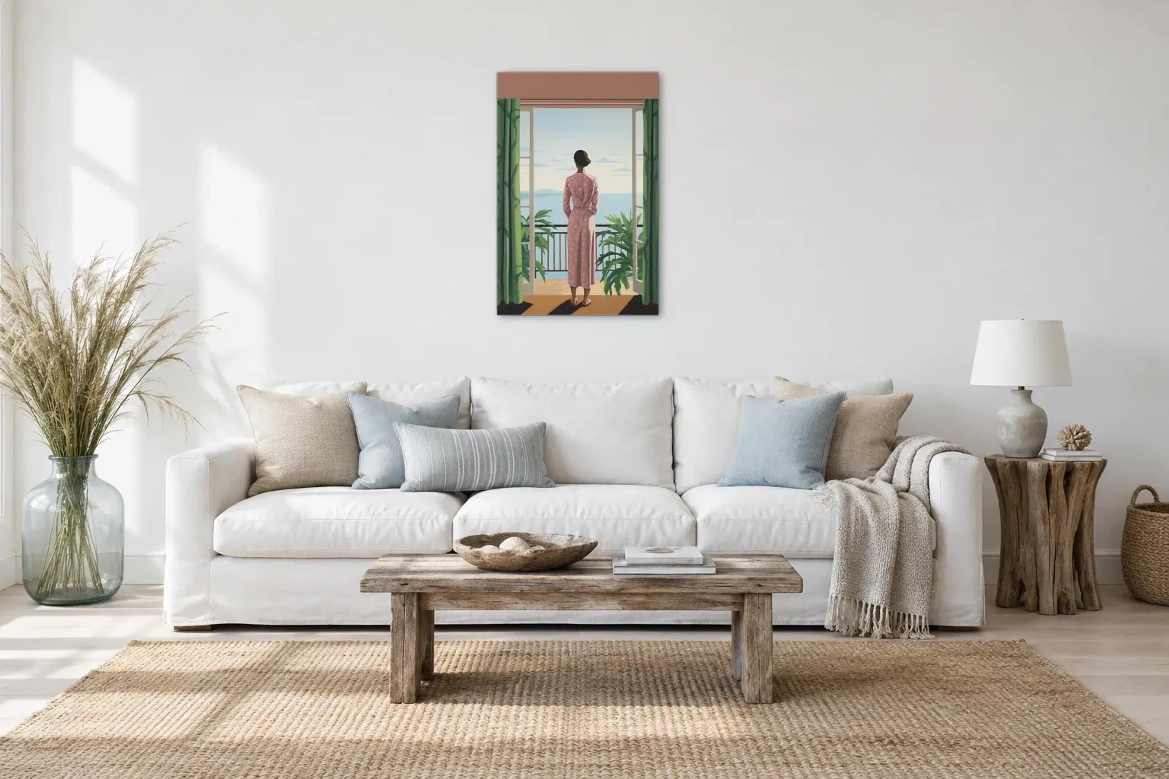 Frau mit Blick aufs Meer als Wandbild über einem 220-cm-Sofa
