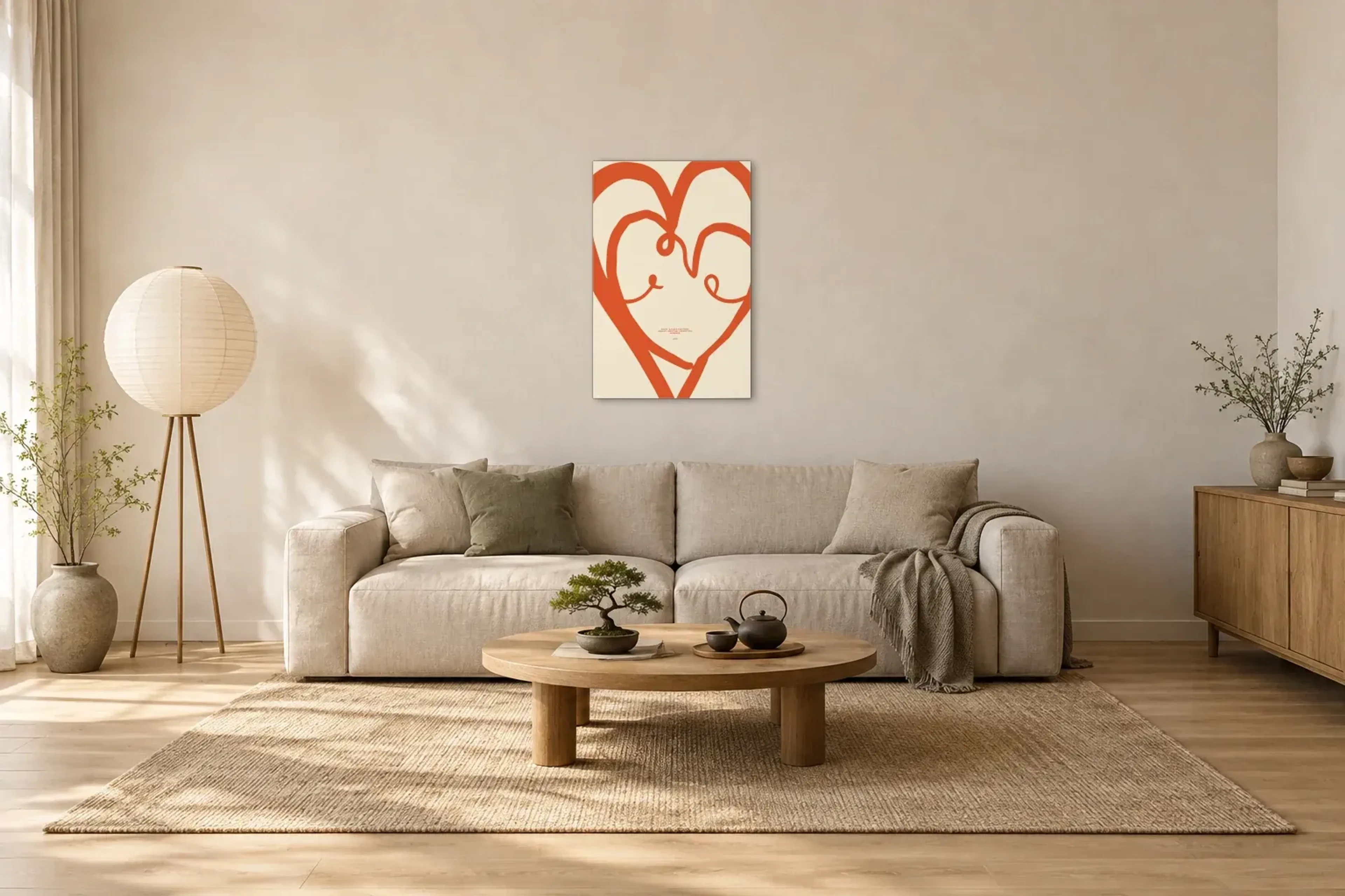Verschlungene Herzen als Wandbild über einem 220-cm-Sofa